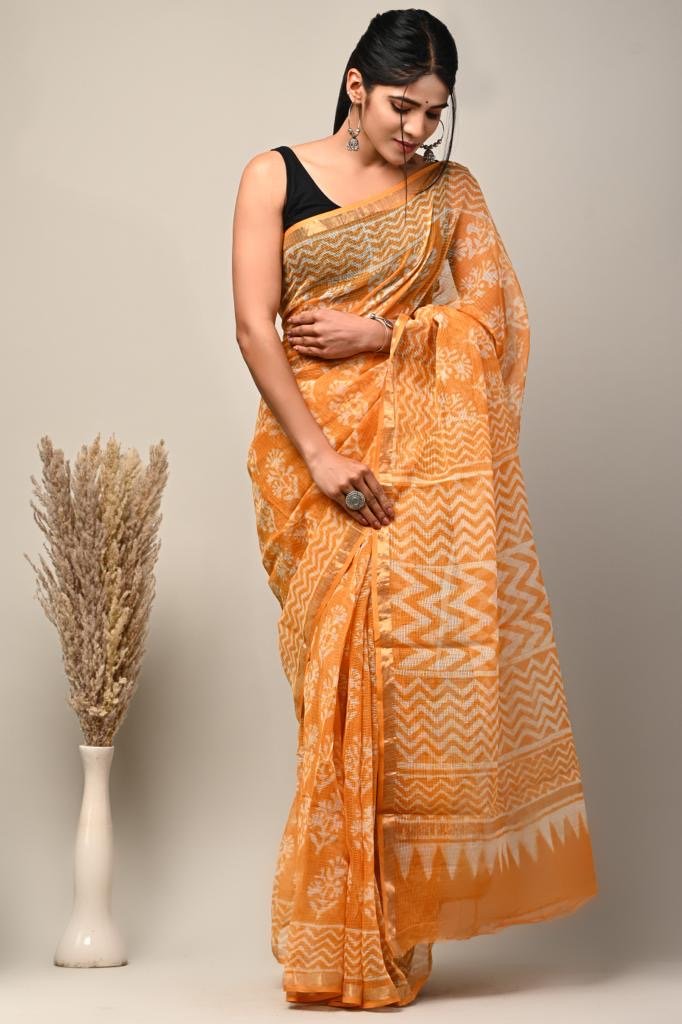 Orange saree with geometric and floral Bagru hand block prints