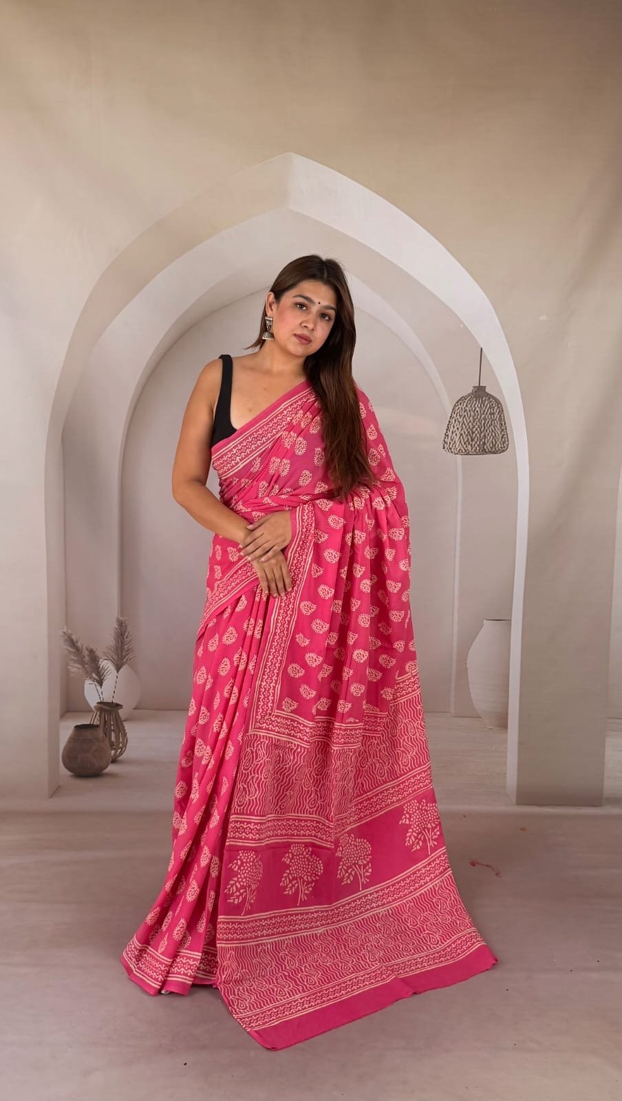 Pink saree with floral motifs and intricate border, Bagru hand block print