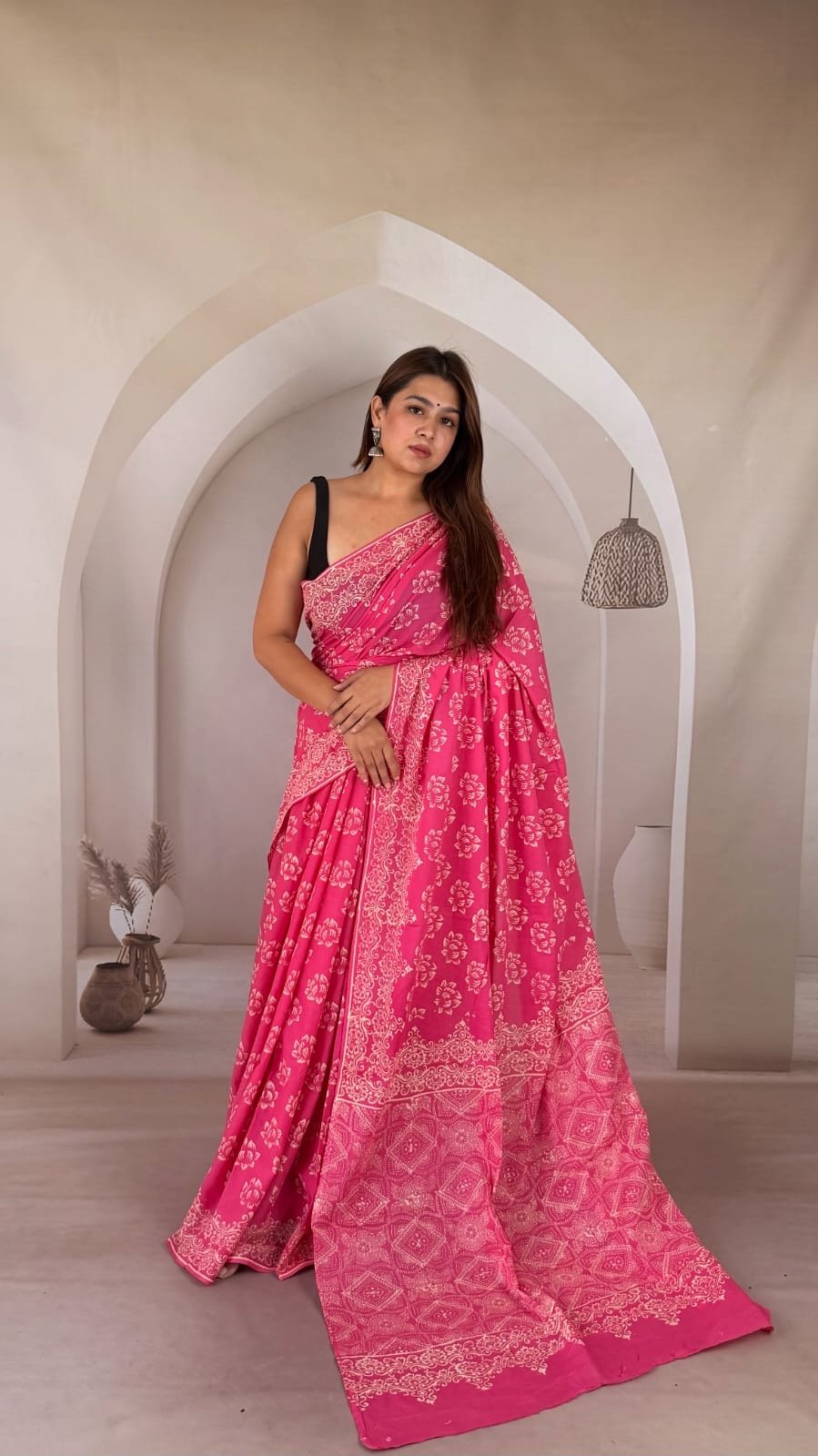 Pink saree with floral motifs, crafted with Bagru hand block print