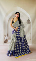 Navy blue saree with white floral motifs and striped border design