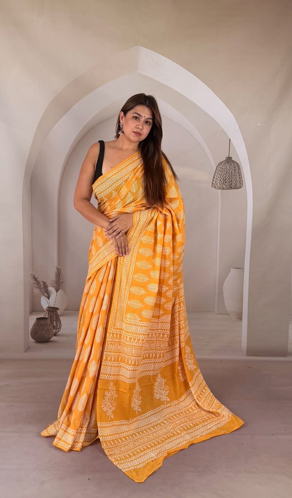 Yellow saree with white floral motifs and traditional Bagru hand block print