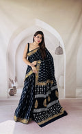 Navy saree with gold floral border and geometric motifs