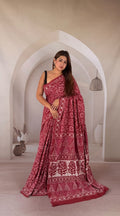 Maroon saree with floral motifs and traditional Bagru print