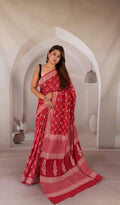 Red saree with buta motifs and intricate borders in Bagru print