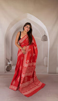 Red saree with fish motifs and intricate border in Bagru hand block print