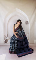 Navy blue saree with white buta motifs and red geometric border