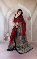 Maroon saree with geometric Bagru block prints and sophisticated border design