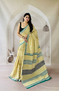 Yellow floral saree with green border and Bagru hand block print