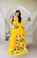 Yellow saree with bold floral motifs designed using Bagru hand block print