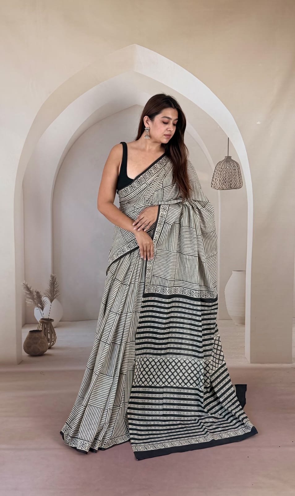 Black and white geometric pattern saree with intricate border details