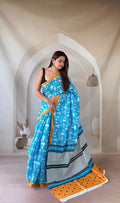 Blue saree with geometric motifs, mustard border, and black and white striped pallu