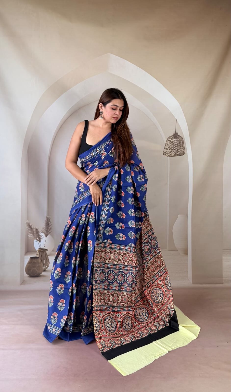 Blue saree with floral and geometric motifs in traditional Bagru hand block print