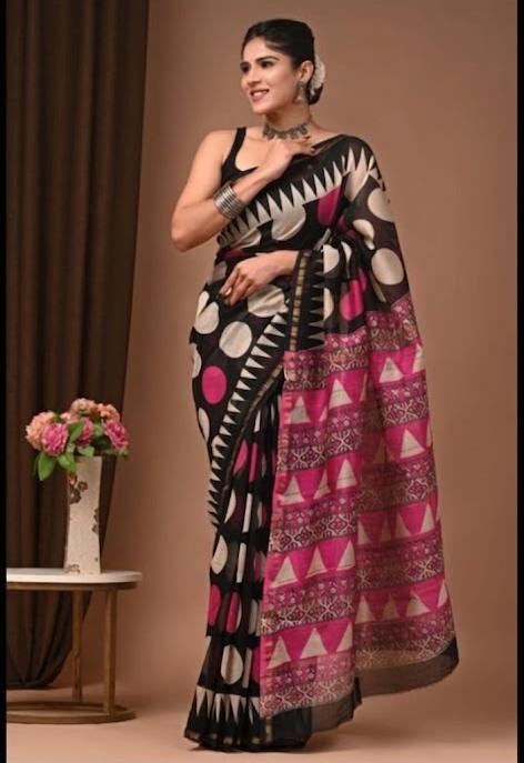 Saree with black base, pink geometric patterns, and bold motifs