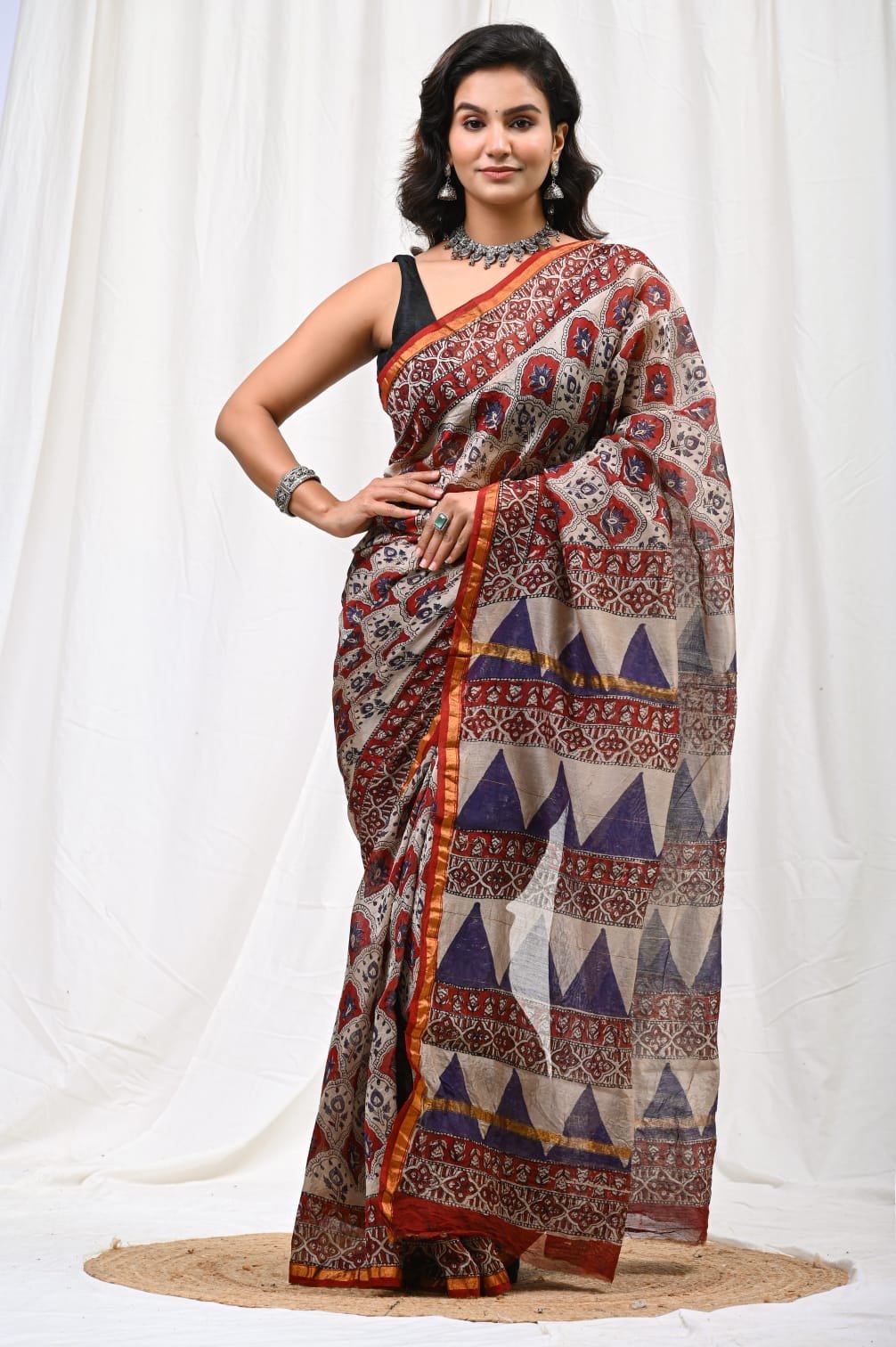 Red and blue saree with floral and geometric motifs in Bagru hand block print
