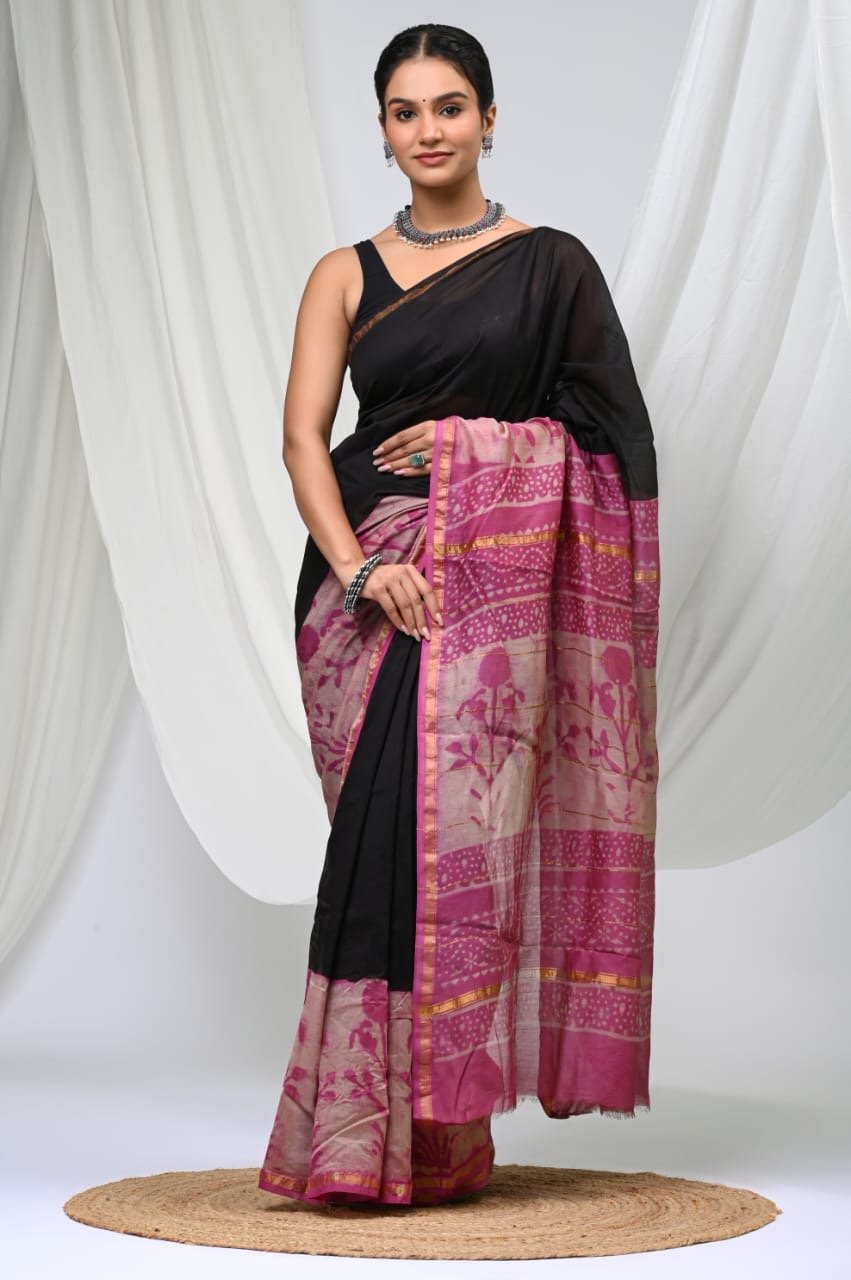 Black and pink saree with floral motifs and geometric borders