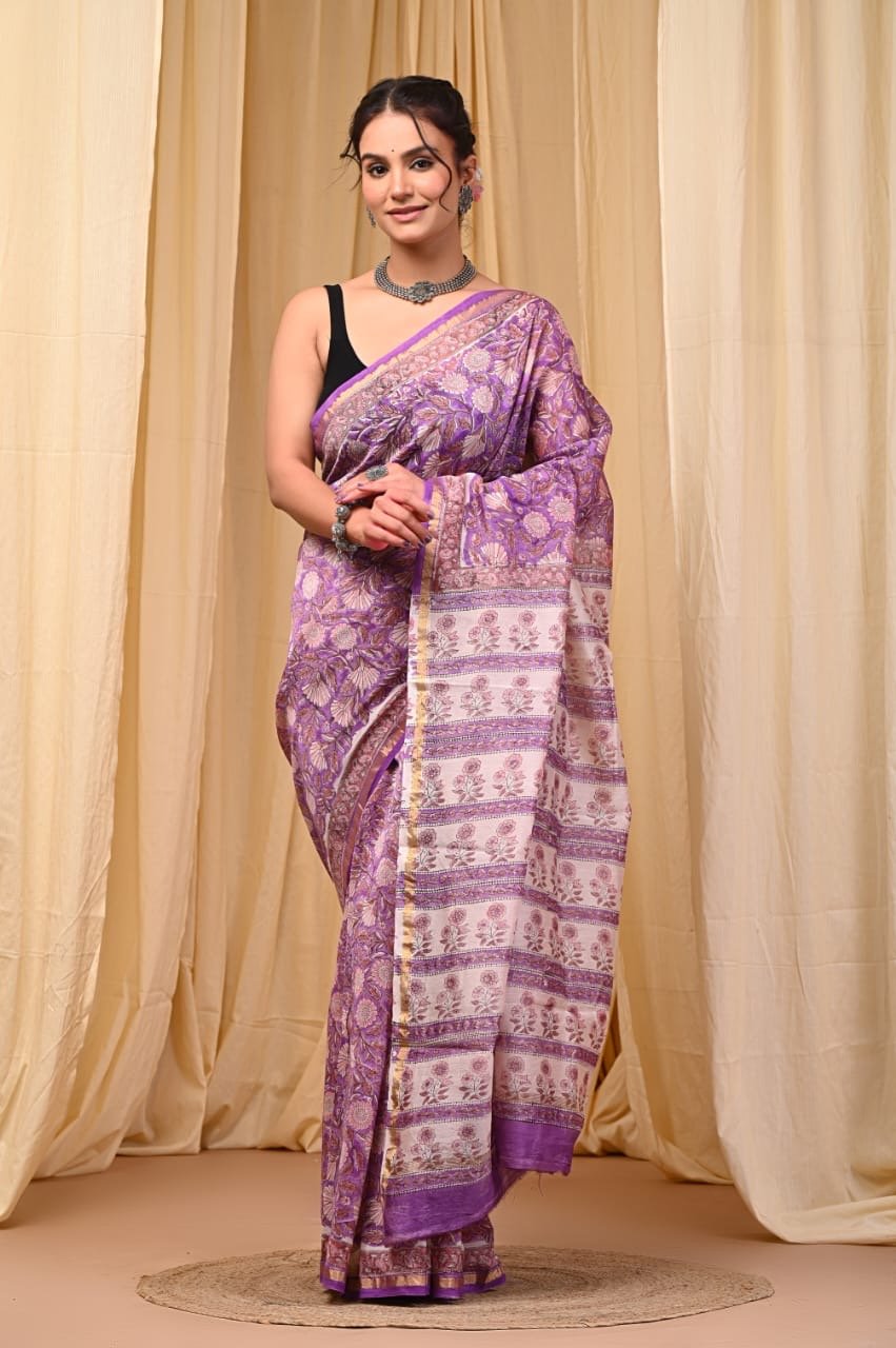 Purple saree with floral motifs and geometric borders in Bagru print