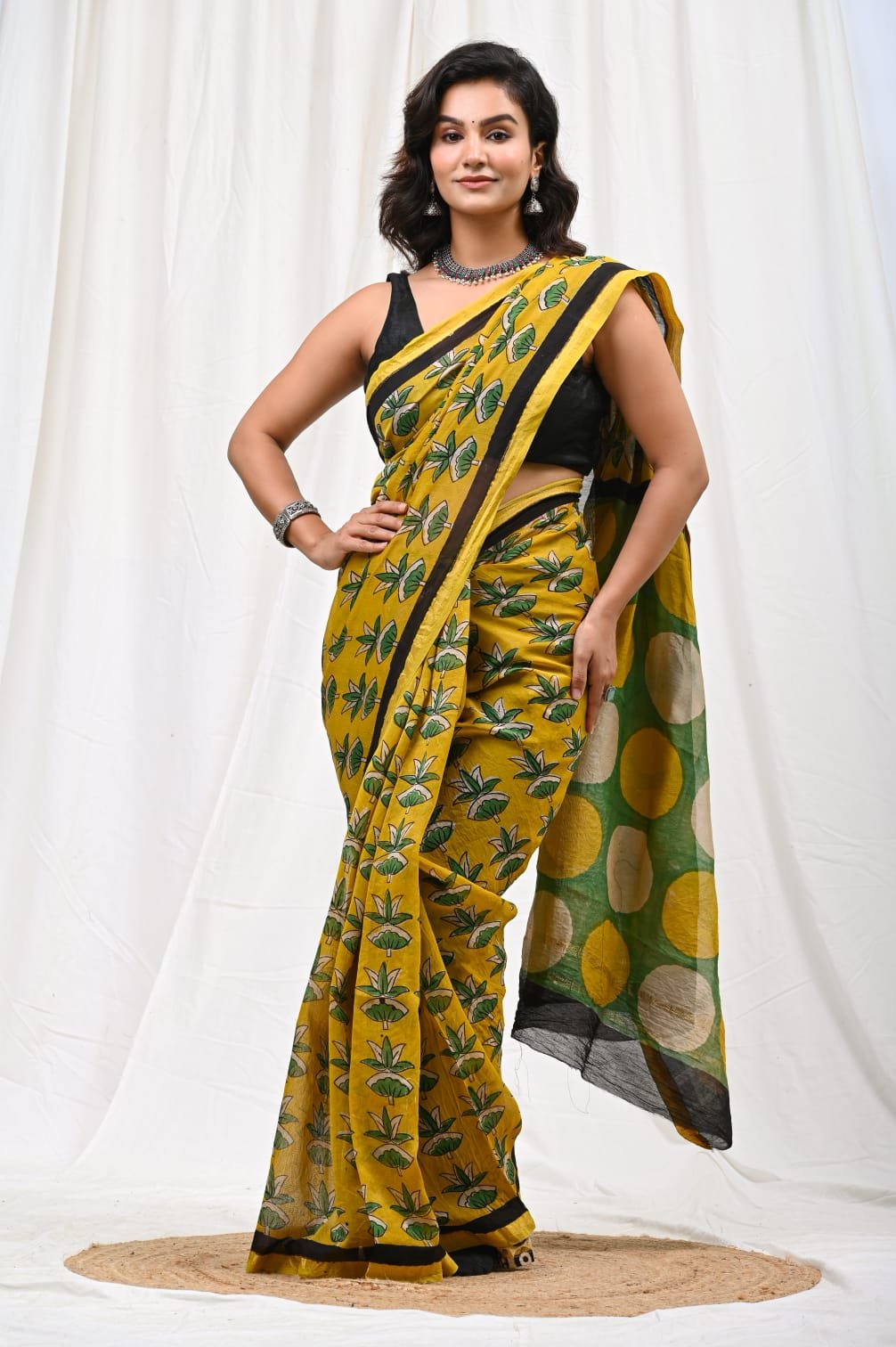 Yellow saree with floral block print and geometric border design