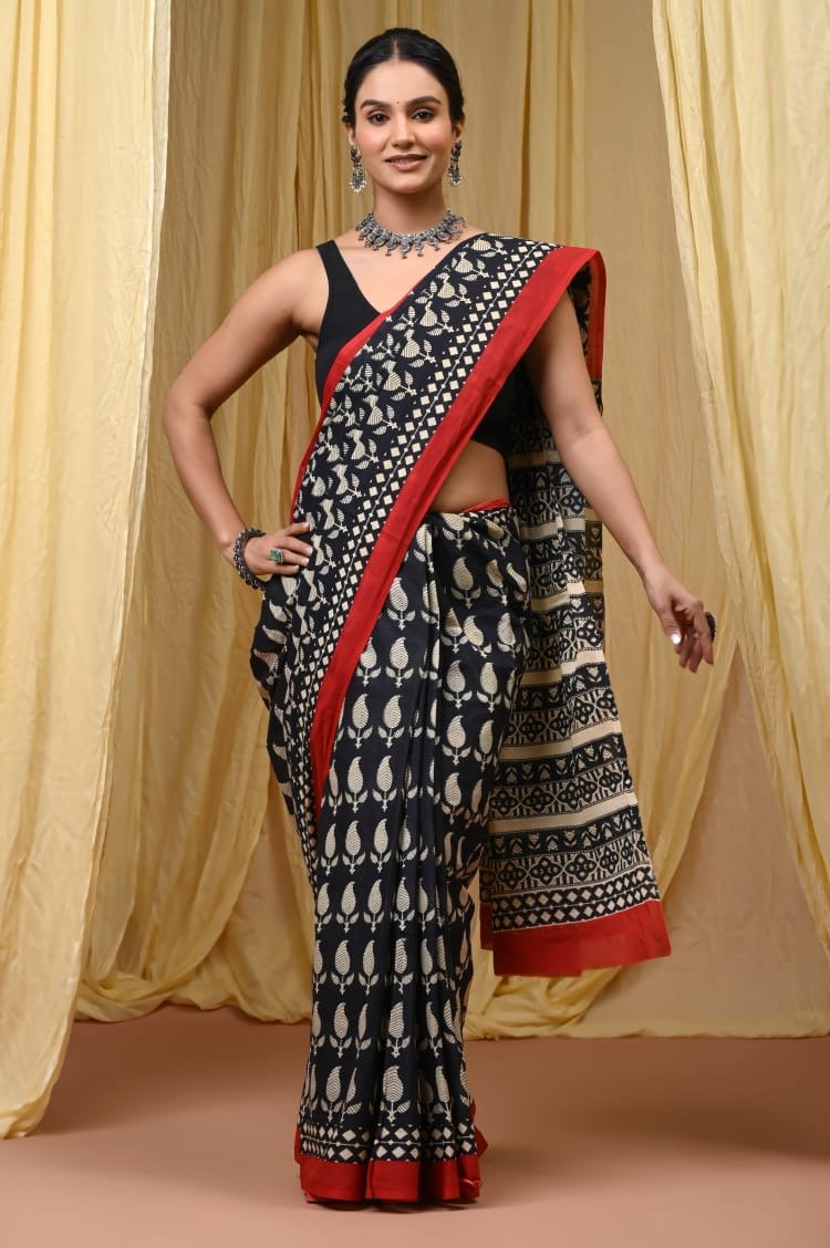 Black saree with red border featuring traditional buta hand block print motifs