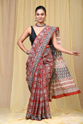 Red saree with floral motifs and black border in Bagru hand block print