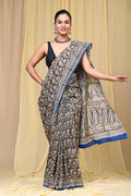 Brown saree with floral motifs, Bagru hand block print, blue accented border