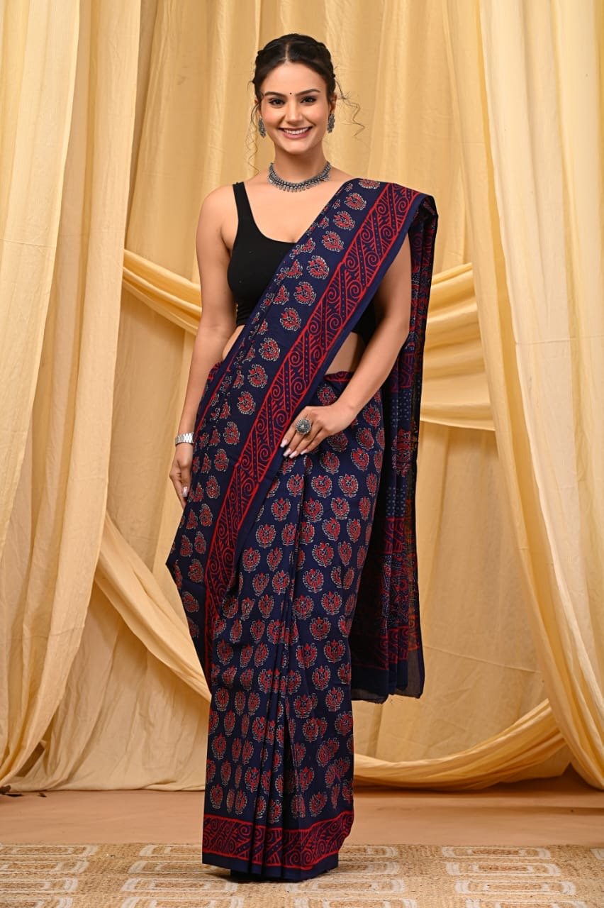 Navy blue saree with red floral and geometric patterns in Bagru print
