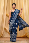 Blue saree with geometric and floral Bagru hand block print patterns.