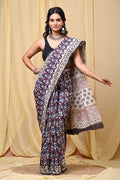 Blue and earthy floral motif saree with geometric border from Jaipur
