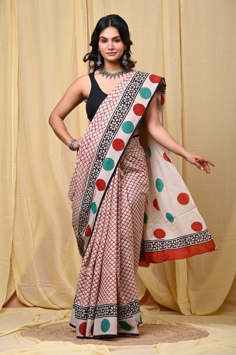 Saree with red and green polka dots, black floral border on Mul Cotton fabric