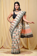 Cream saree with red and green floral motifs and geometric border