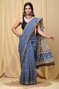 Blue saree with floral motifs and intricate border design