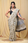 Cream Mul Cotton saree with floral motifs and geometric border