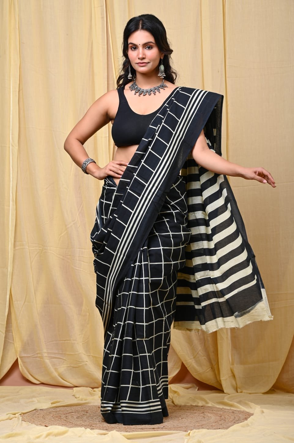 Black and white saree with geometric checkered and striped patterns