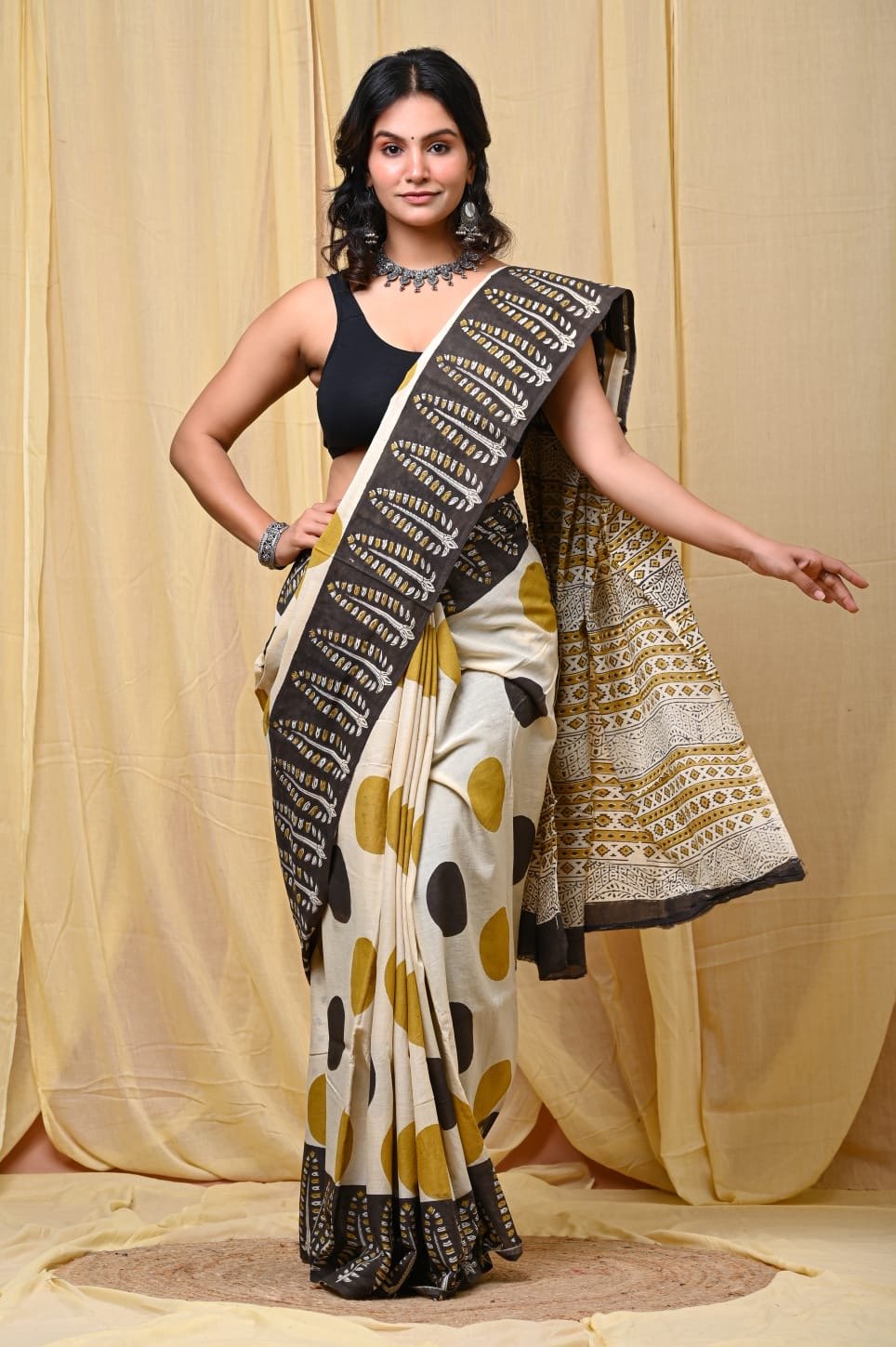 Mustard yellow and black saree with geometric Bagru hand block print design