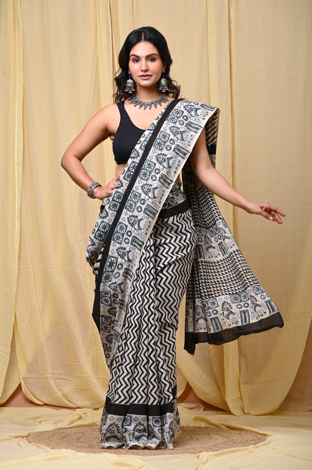 Black and white saree with elephant motifs and geometric patterns in Bagru print