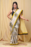 Yellow floral motif saree with striped pallu and contrasting border in Mul Cotton