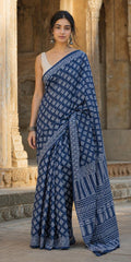 Navy blue saree with geometric motifs and intricate border in traditional Bagru print