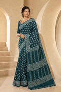 Teal saree with buta motifs and intricate border design