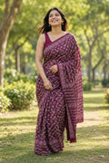 Maroon saree with floral motifs and traditional Bagru design
