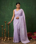 Lavender saree with white floral motifs and intricate border design