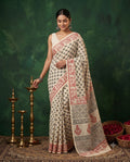 Cream and red saree with paisley and geometric motifs