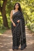 Black saree with geometric motifs and intricate border pattern