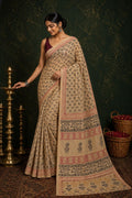 Beige saree with floral motifs, red and black border hand block printed design