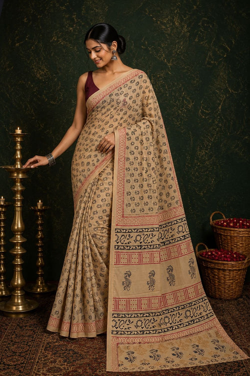Beige saree with floral motifs, red and black border hand block printed design