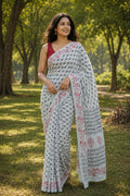 White saree with black buta motifs and red floral border design