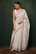 Off-white saree with maroon floral hand block print design