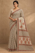 Beige saree with floral motifs and rust border using Bagru hand block print